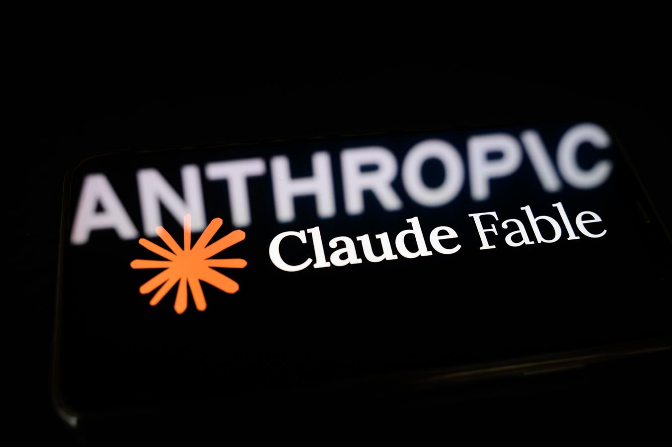 The Anthropic logo displayed on a screen as the company restores global access to its Claude Fable 5 AI model