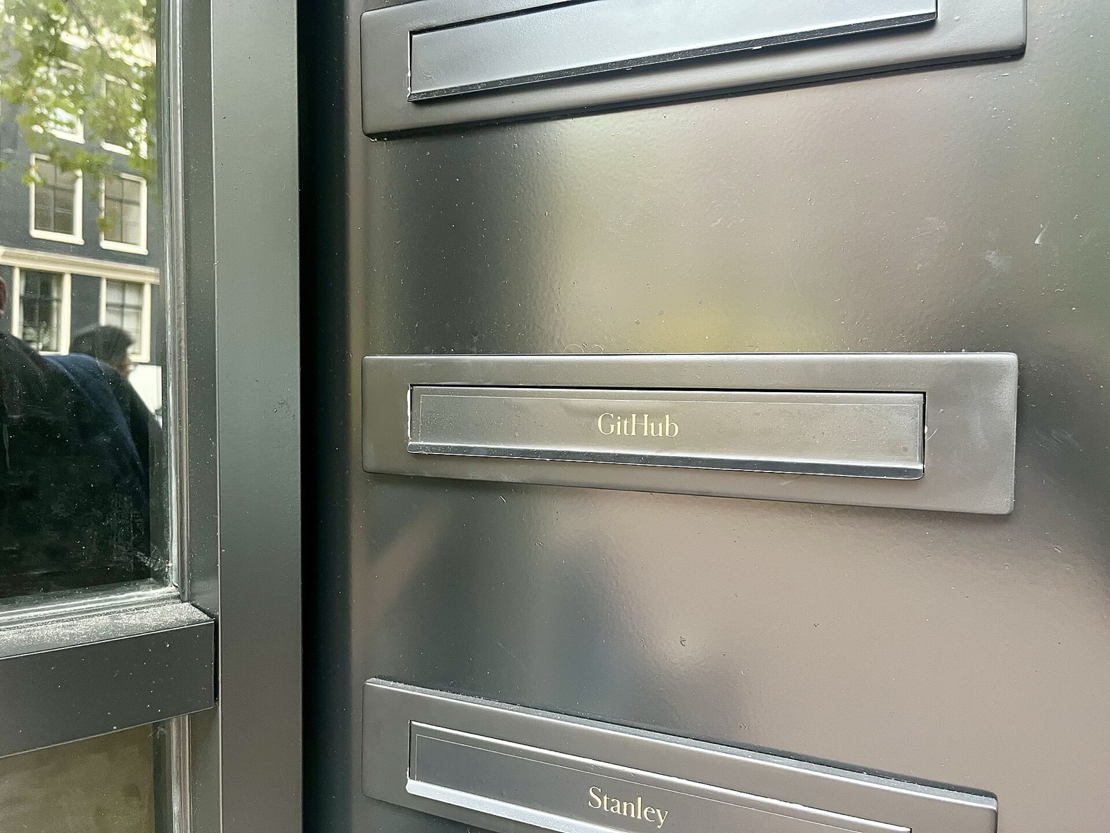 A letterbox bearing GitHub's Octocat logo at the company's office on Spuistraat in Amsterdam. Photo: Rrustema via Wikimedia Commons, CC0.