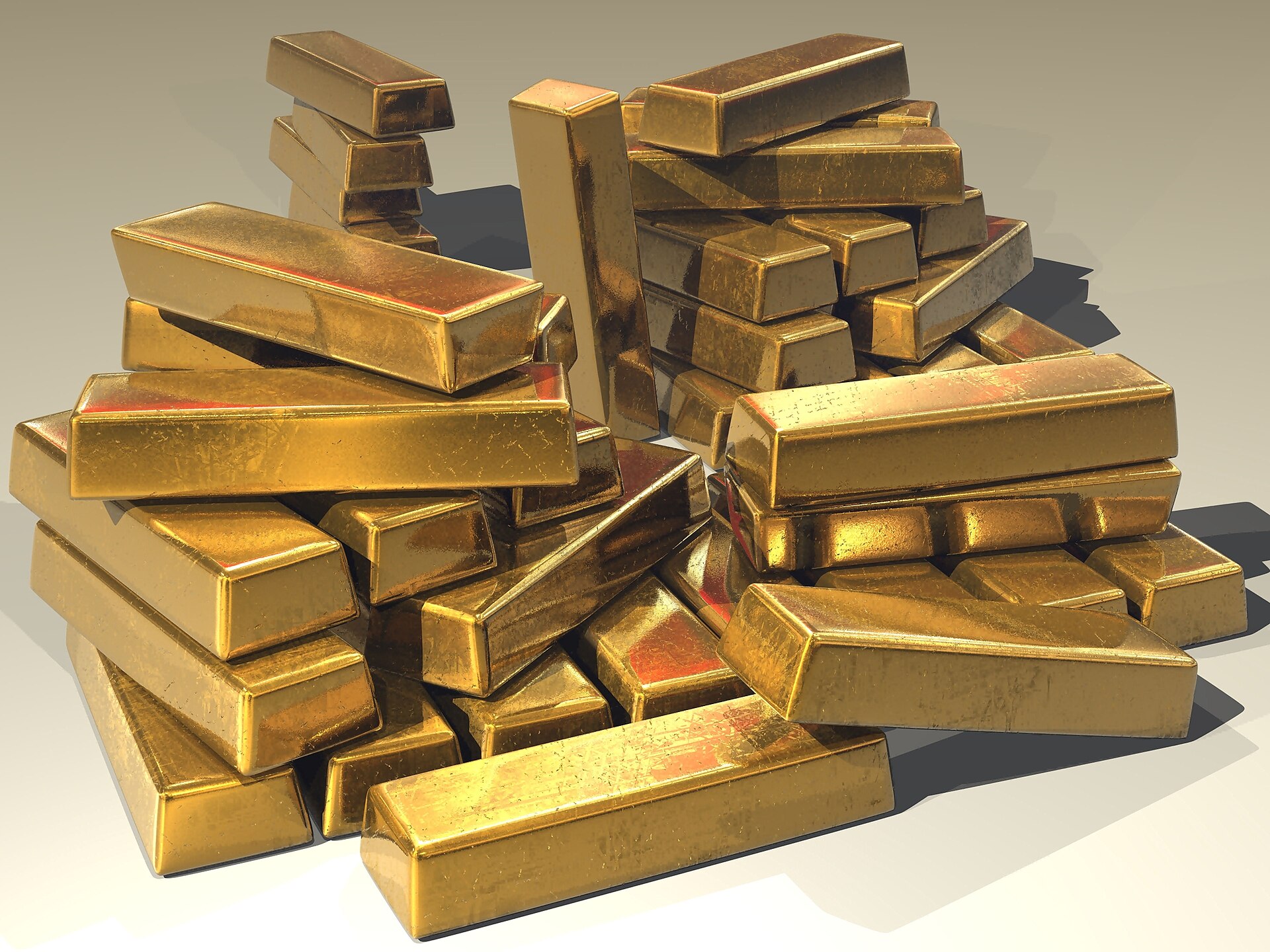 Cast gold bullion bars stacked in a pile. Photo: Stevebidmead / Wikimedia Commons, CC0