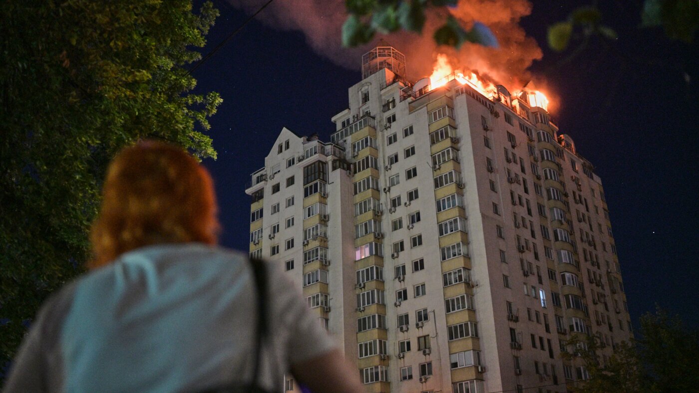 Emergency crews search rubble of a collapsed Kyiv building after a Russian missile and drone strike. Photo: NPR