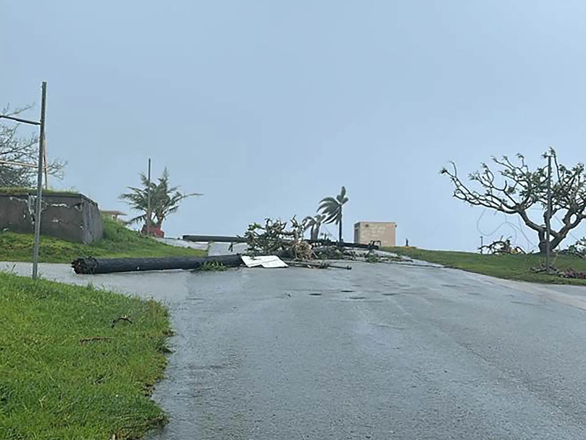 Storm damage and fallen trees on a US Pacific island struck the same July weekend. Photo: Al Jazeera