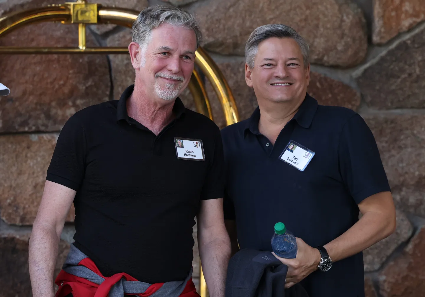 Netflix executives Reed Hastings and Ted Sarandos at an industry conference as takeover speculation cools. Photo: Fortune