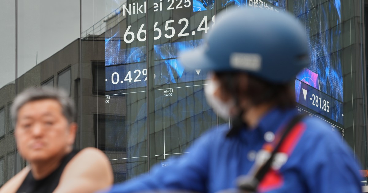Electronic stock board in Tokyo displaying the Nikkei 225 index at a record high above 72,000 points