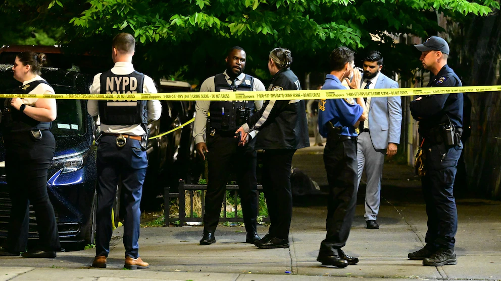 Police cordon and evidence markers outside a Coney Island residence after a July 4 shooting wounded eight people. Photo: ABC News