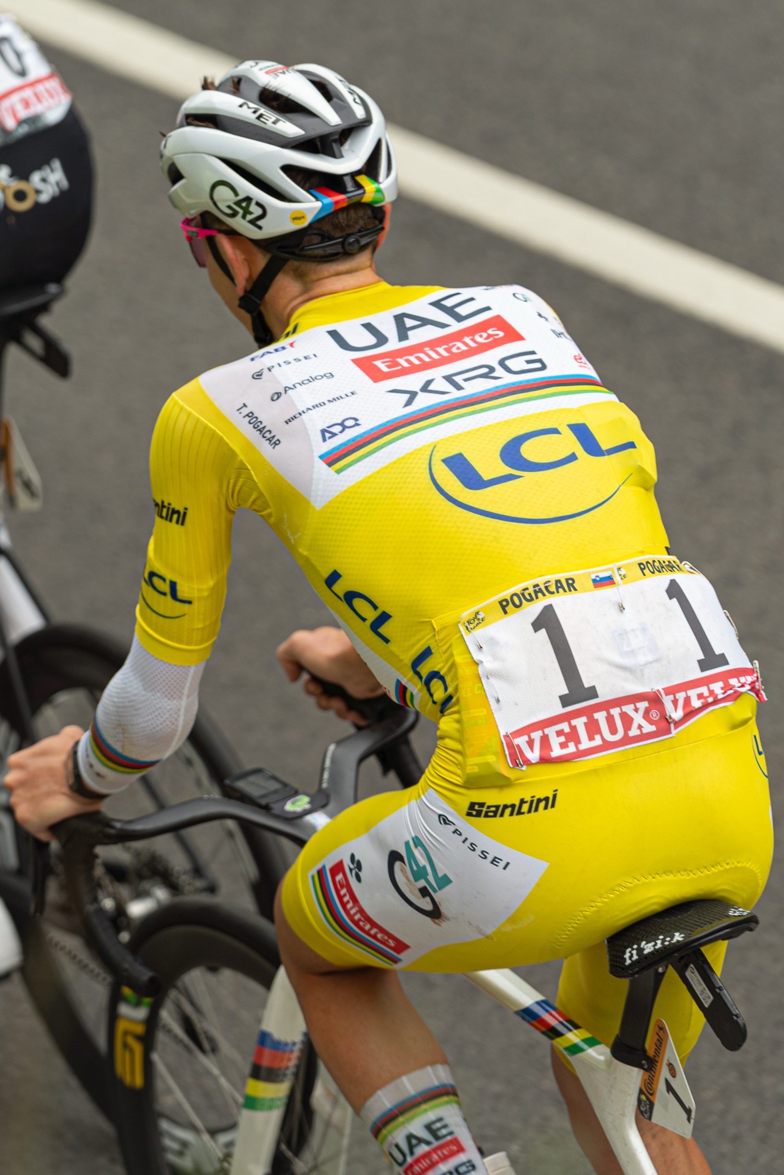 Tadej Pogacar rides in the race leader's yellow jersey during a Tour de France mountain stage. Photo: Hugo LUC / Wikimedia Commons, CC BY-SA 4.0.