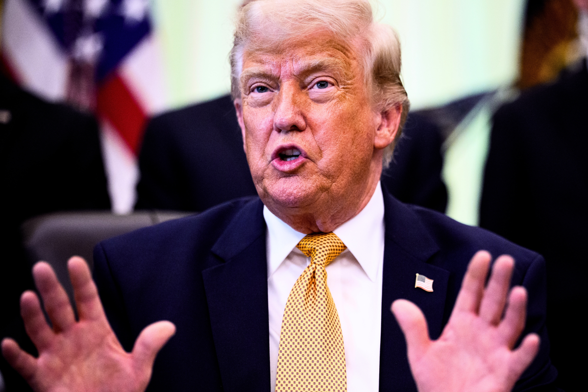 President Donald Trump speaking at a White House podium as approval polling declines in June 2026