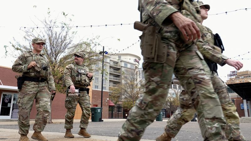 National Guard soldiers and police on a downtown Memphis street after a fatal shooting. Photo: CNN