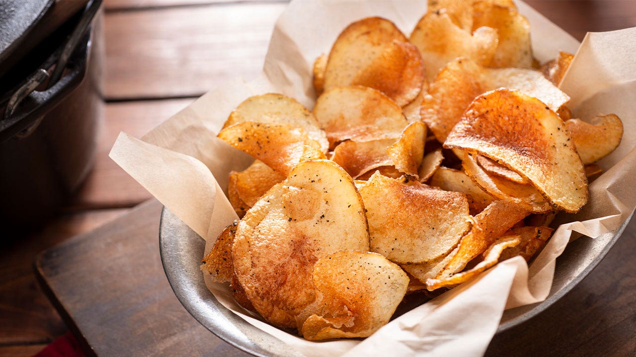 Bags of Zapp's and Dirty brand potato chips on a store shelf affected by an FDA salmonella recall