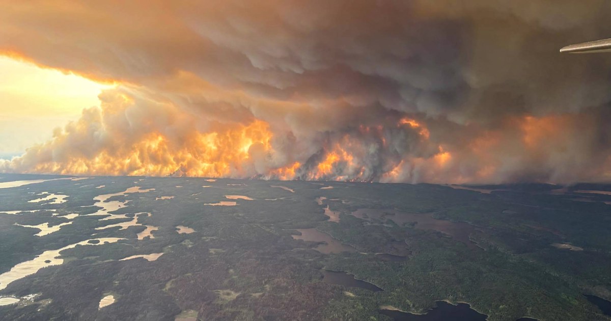 Hazy smoke-filled sky over a U.S. city skyline as wildfire smoke reduces visibility and degrades air quality